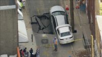 Car falls into sinkhole, another teeters on edge in Philadelphia