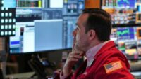 Sell-off worsens worldwide and Dow drops 1,200 after China retaliates against Trump tariffs