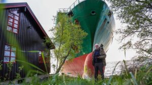 Cargo ship crashes into man’s yard after crewman fell asleep, police say