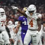Texas Longhorns running back CJ Baxter (4) celebrates a first down during the Sugar Bowl College Football Playoff semifinals game against the Washington Huskies at the Caesars Superdome on Monday, Jan. 1, 2024 in New Orleans, Louisiana.